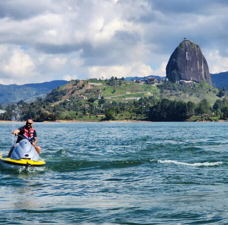 day trip from medellin to guatape with a jetsky in front of the rock el penol