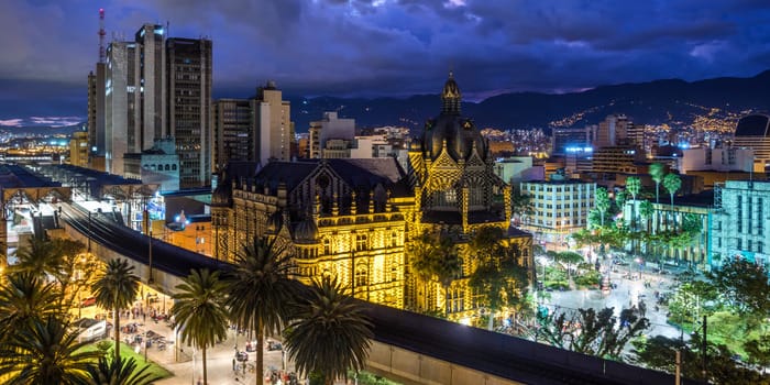 A beautifully illuminated view of downtown Medellín at night, a scene that many travelers wonder about when asking 'is Medellin safe' for exploring after dark.