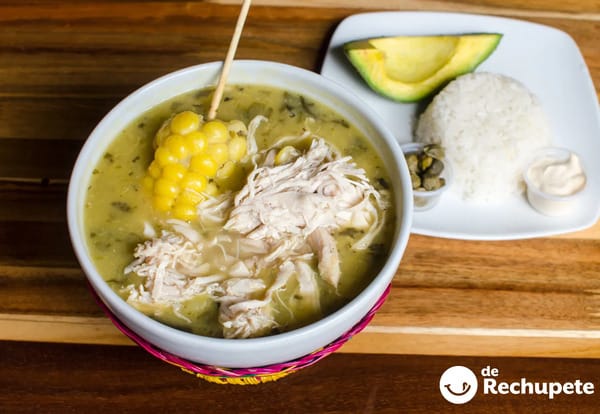 A bowl of traditional Ajiaco soup, an example of the delicious and affordable local food that contributes to the low cost of living in colombia.