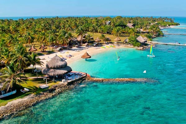 A thatched-roof hut at a sunny beach resort in the San Bernardo Island, a top destination among the Colombian islands for day trips.