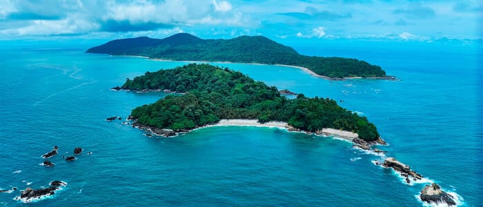 An aerial view of the dense, tropical rainforest covering Gorgona Island, a biodiverse national park and one of the Pacific Colombian islands.