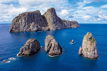 Dramatic, rocky cliffs of Malpelo, one of the remote Pacific Colombian islands renowned for world-class scuba diving.