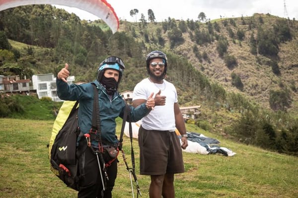 Enjoying the incredible views and peaceful feeling of flight during a tandem paragliding experience, one of the best day trips from Medellin.