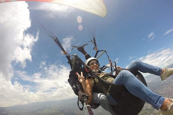 Stunning aerial view of the Aburrá Valley during a tandem paragliding flight, a highly-rated day trip from Medellin.