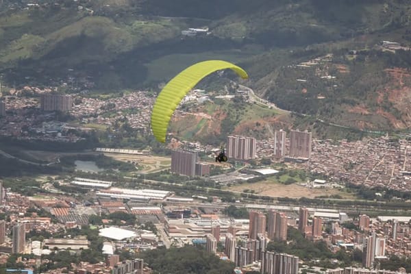 The exciting moment of takeoff for a paragliding adventure in the mountains near Medellin, Colombia.