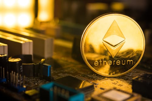 Close-up of an Ethereum coin on a circuit board, symbolizing Ethereum's role in the tech and crypto Medellin ecosystem.